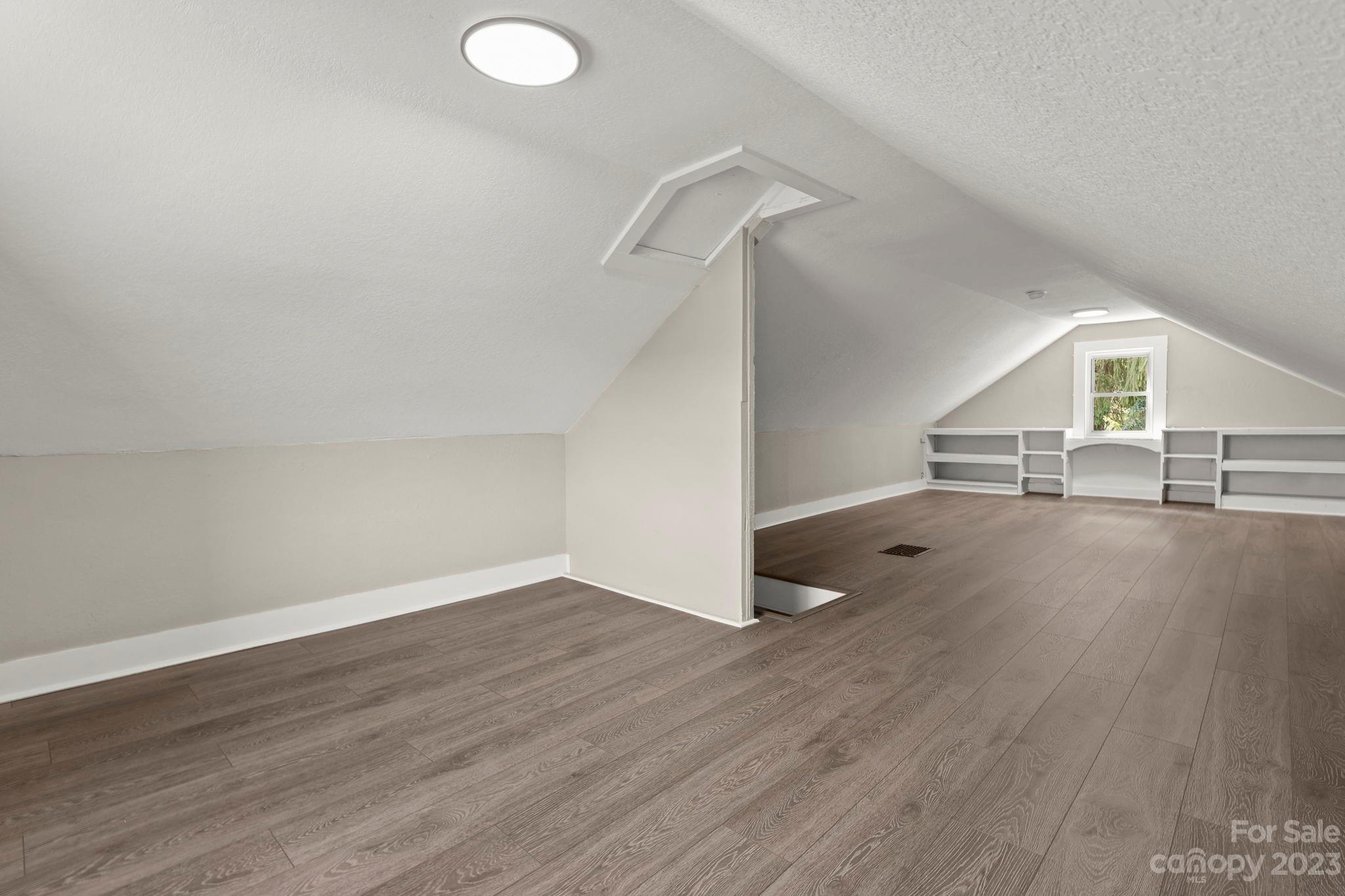 185 Substation Road Canton, NC 28716 - Photo 19 of 32 wooden floor in an empty room with a window