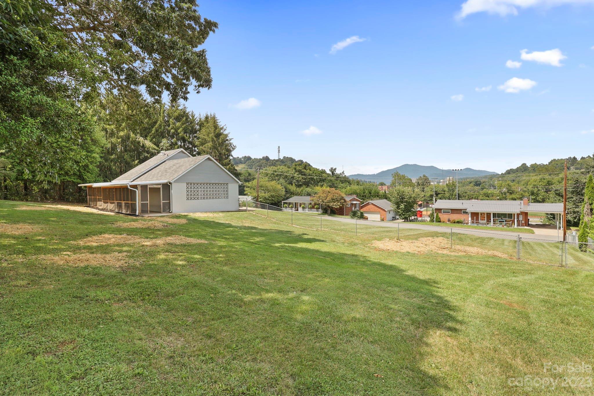 185 Substation Road Canton, NC 28716 - Photo 30 of 32 a view of a house with a yard