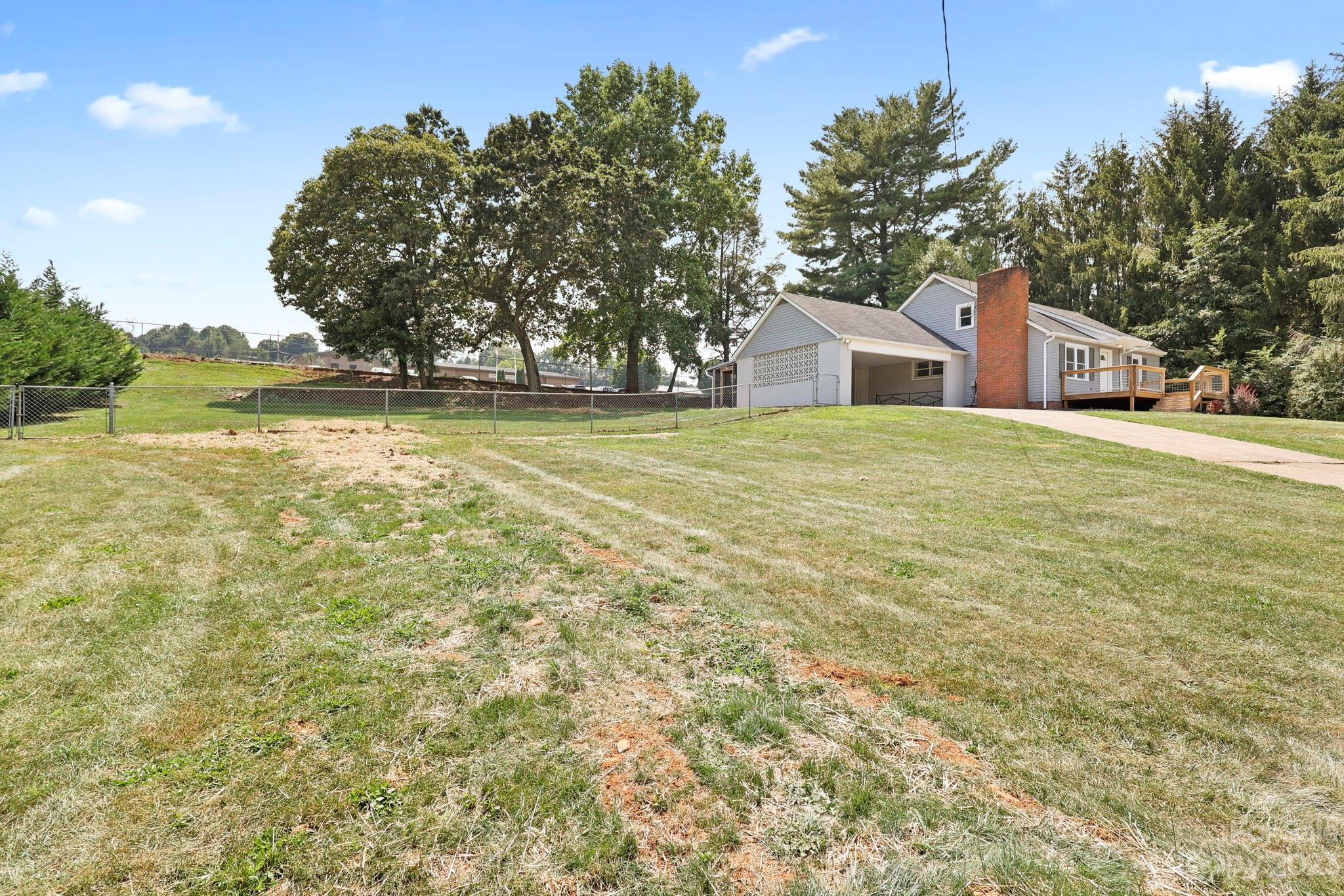 185 Substation Road Canton, NC 28716 - Photo 3 of 32 a front view of a house with a yard and trees