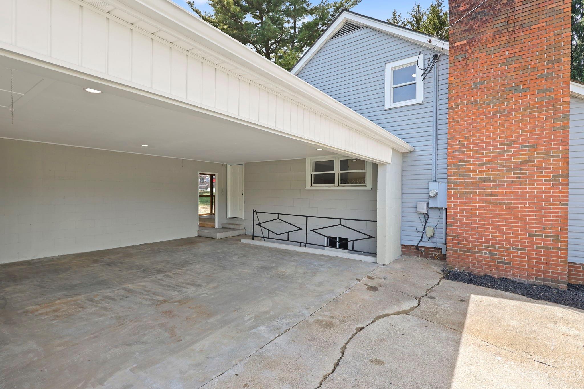 185 Substation Road Canton, NC 28716 - Photo 4 of 32 a view of a house with a patio