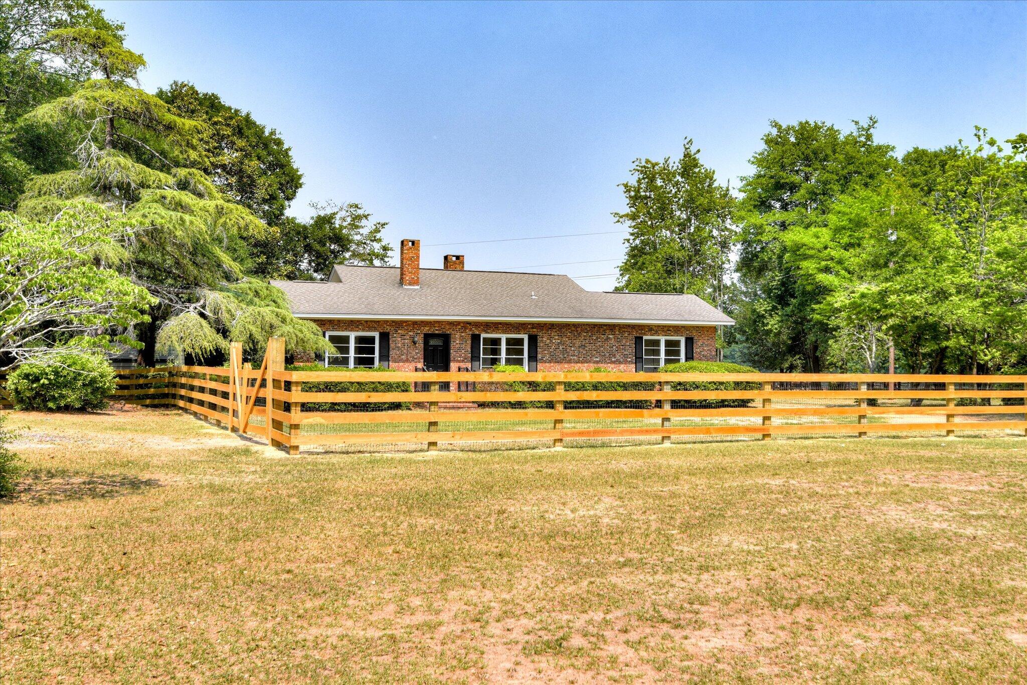 126 Mosley Road Aiken, SC 29801 - Photo 2 of 29 a front view of a house with swimming pool