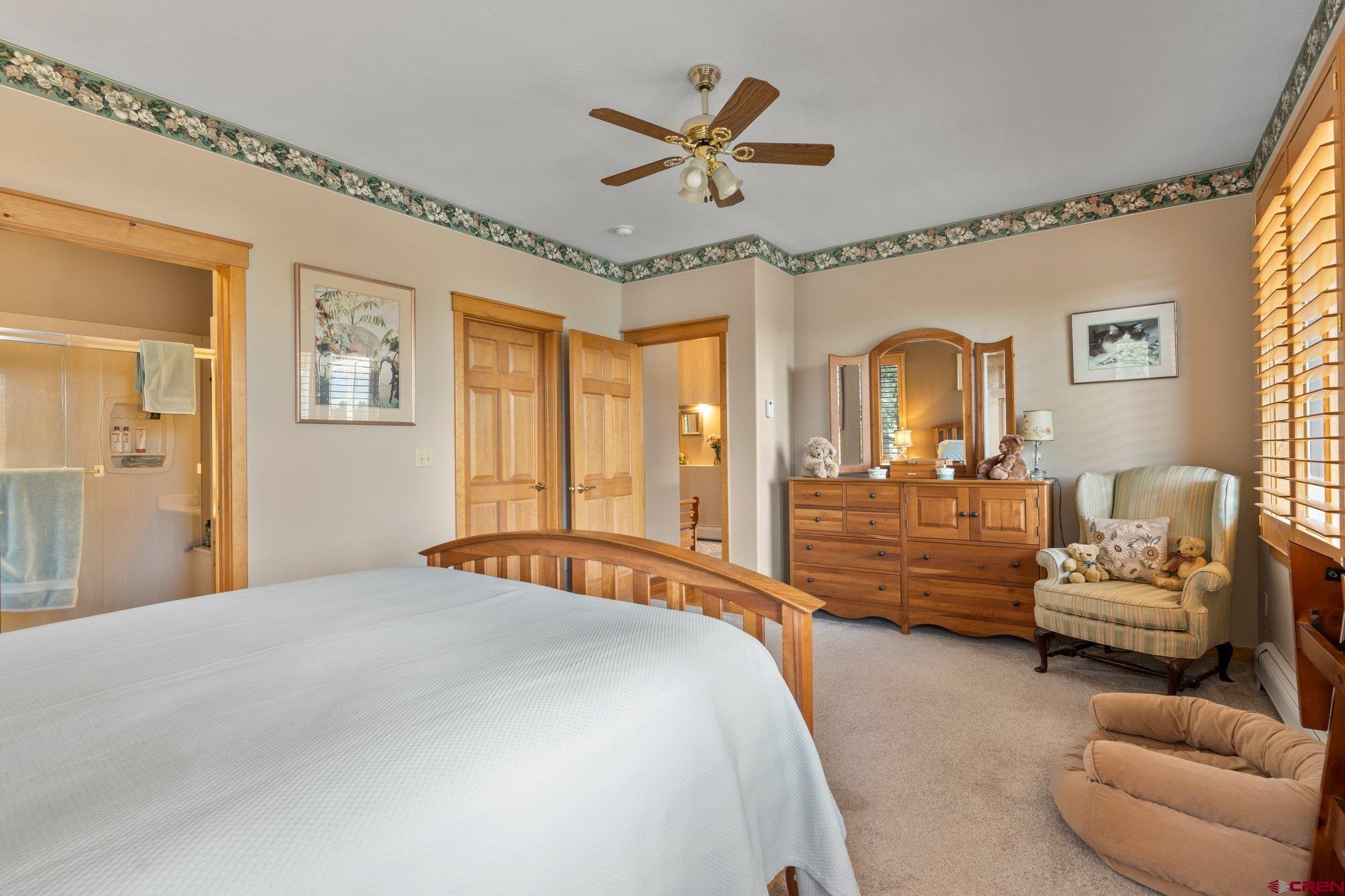 60 Edgemont Way Durango, CO 81301 - Photo 15 of 35 a bedroom with a bed and ceiling fan
