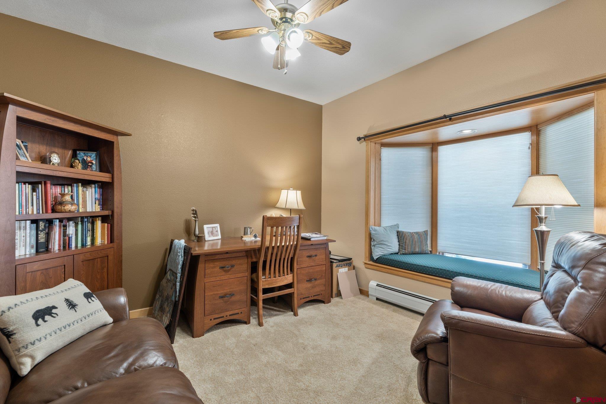60 Edgemont Way Durango, CO 81301 - Photo 17 of 35 a living room with furniture and a lamp
