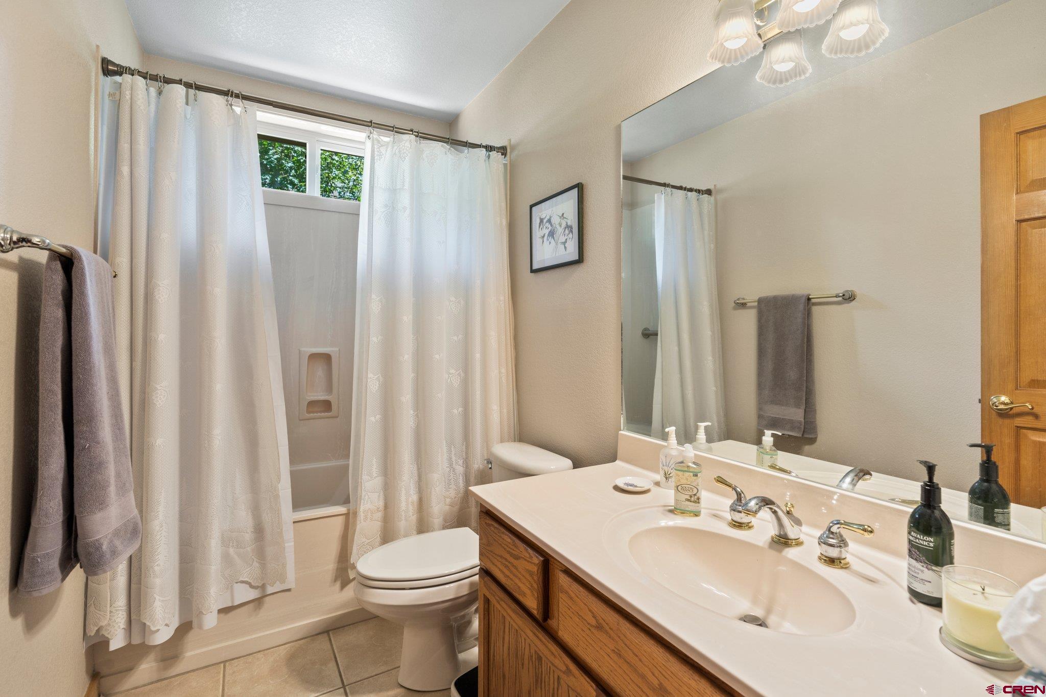 60 Edgemont Way Durango, CO 81301 - Photo 18 of 35 a bathroom with a sink toilet and shower