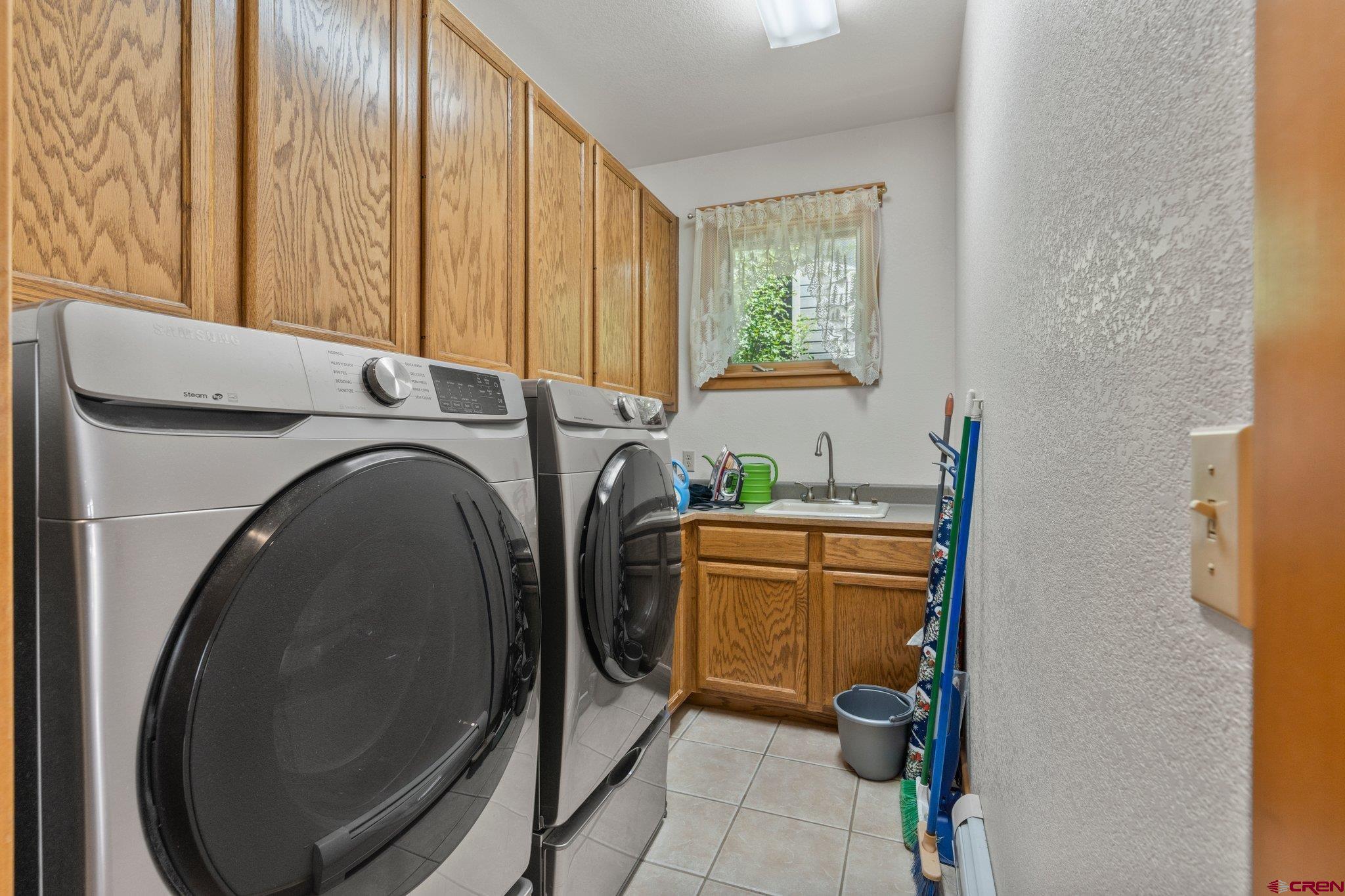 60 Edgemont Way Durango, CO 81301 - Photo 19 of 35 a utility room with dryer and washer