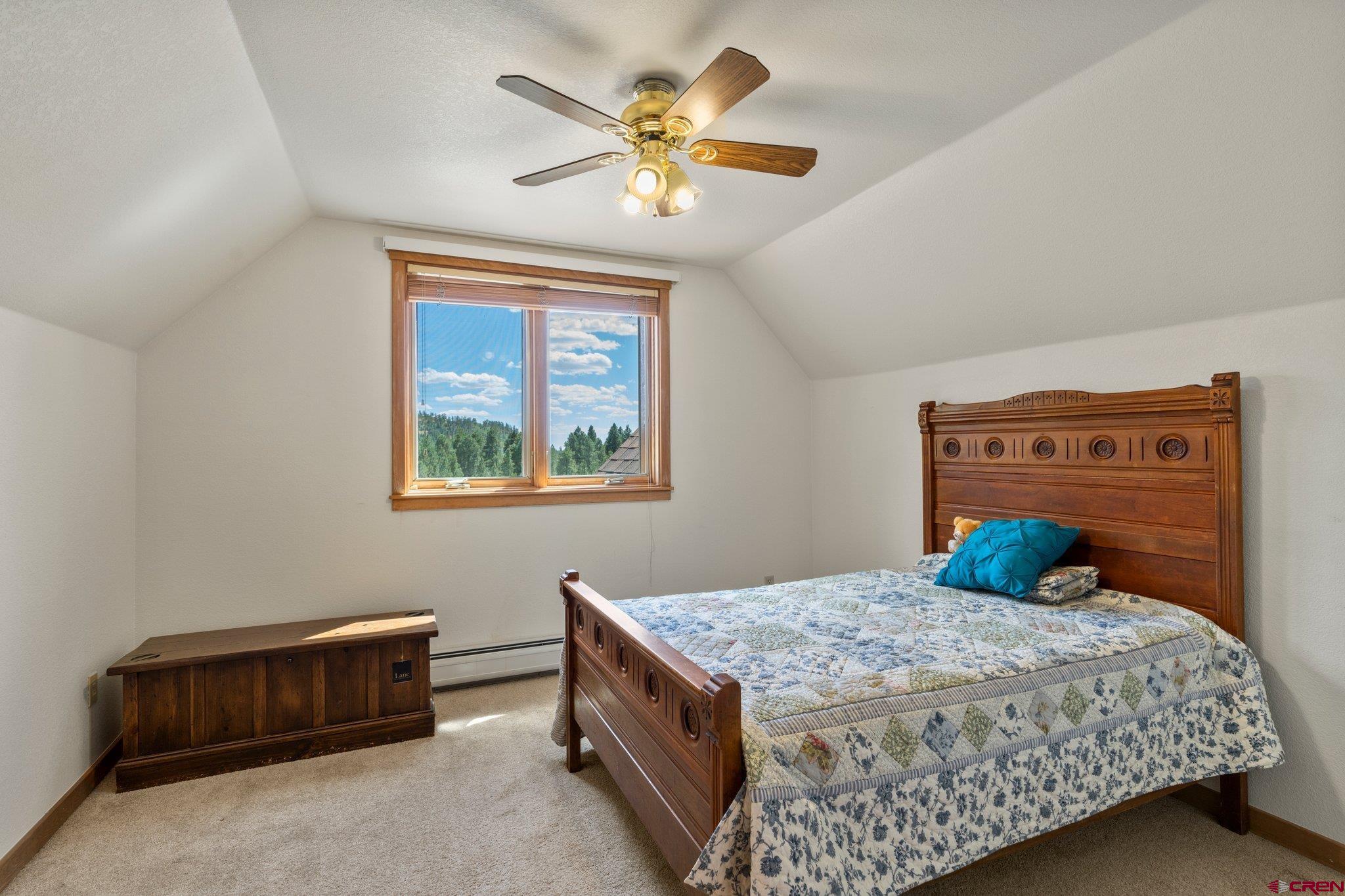 60 Edgemont Way Durango, CO 81301 - Photo 20 of 35 a bedroom with a bed and a window