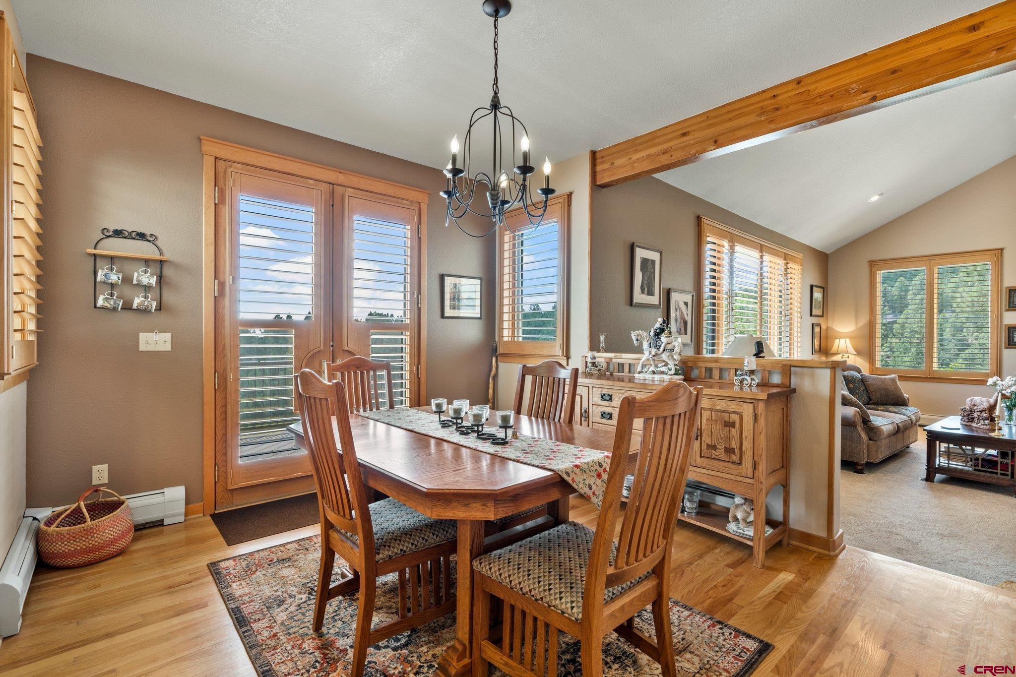 60 Edgemont Way Durango, CO 81301 - Photo 22 of 35 a view of a dining room with furniture window and wooden floor