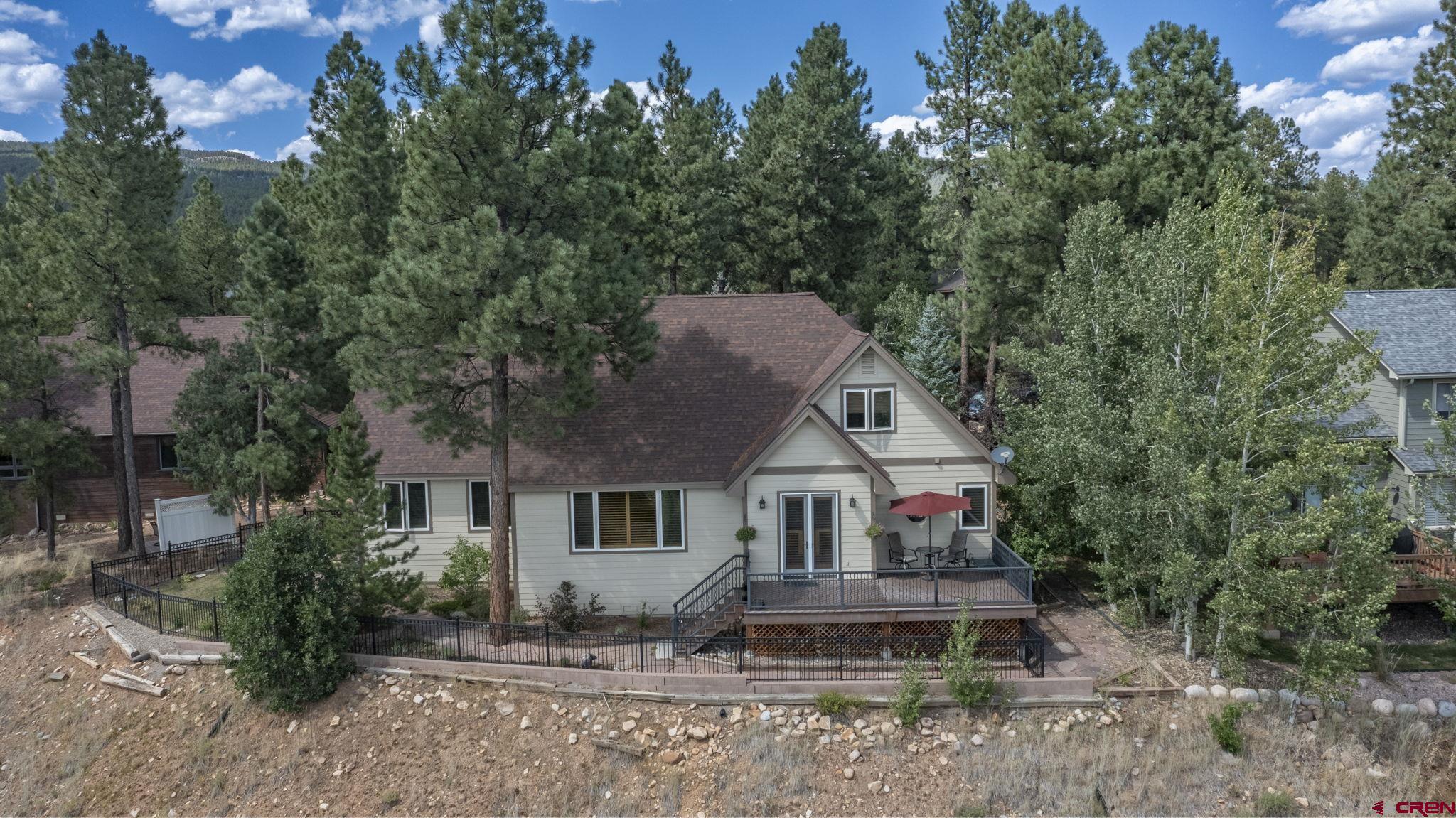 60 Edgemont Way Durango, CO 81301 - Photo 33 of 35 a front view of a house with a yard