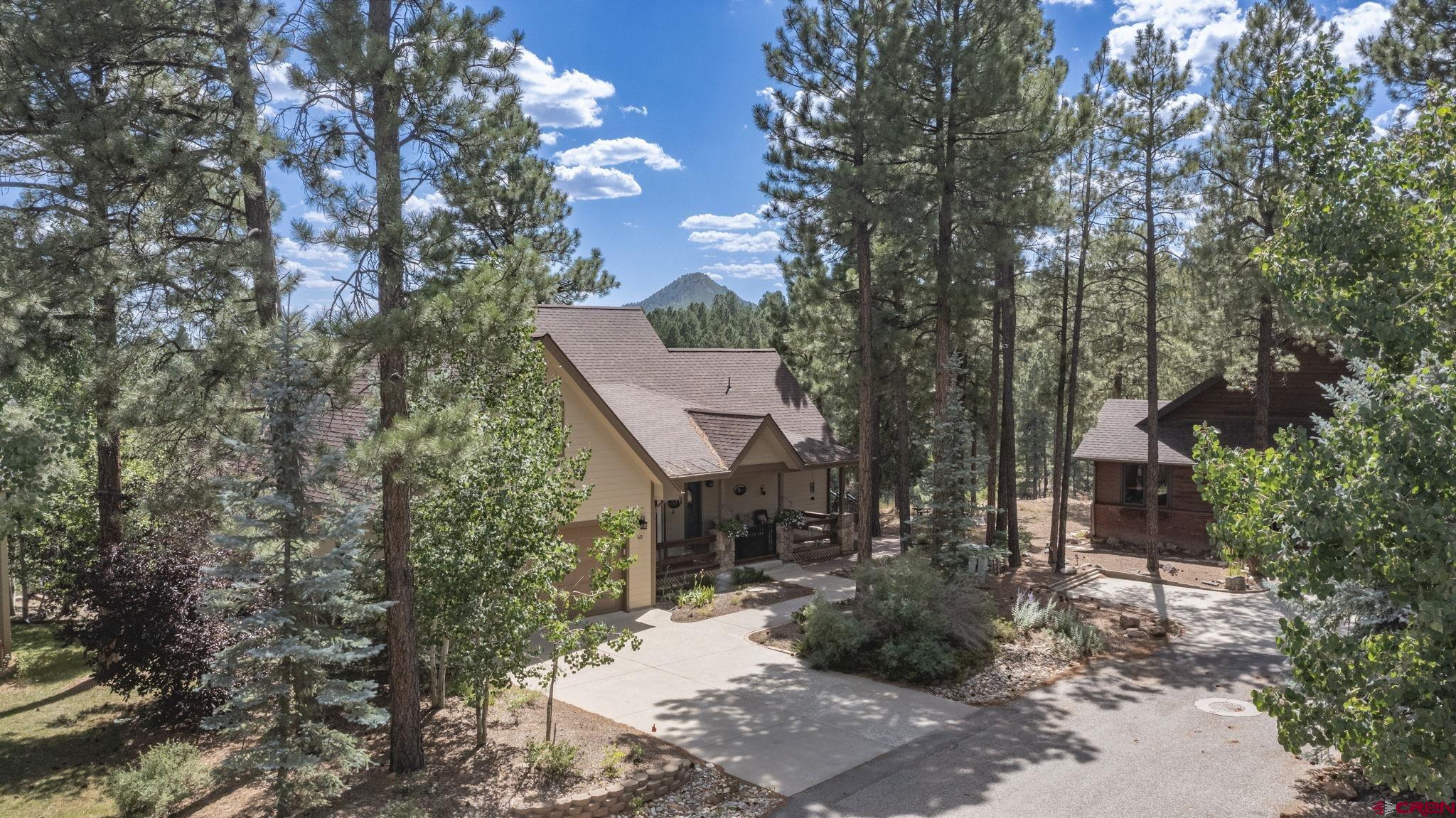 60 Edgemont Way Durango, CO 81301 - Photo 35 of 35 a view of a house with a tree next to a yard