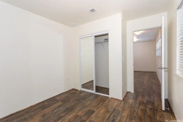 a view of wooden floor in an empty room