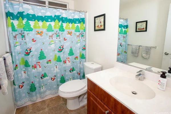 a bathroom with a sink toilet and mirror
