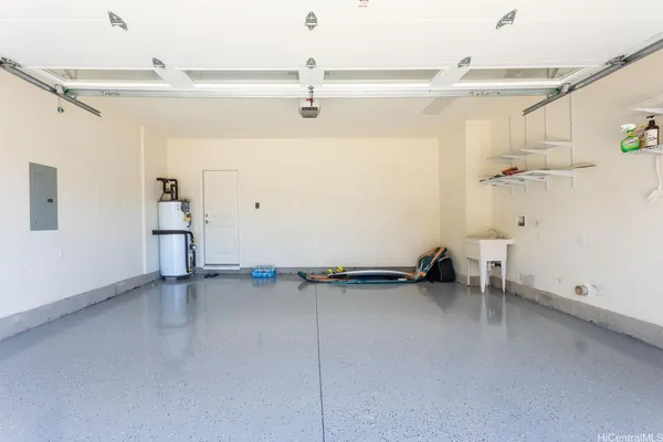 a view of a room with rack on the wall and a chandelier