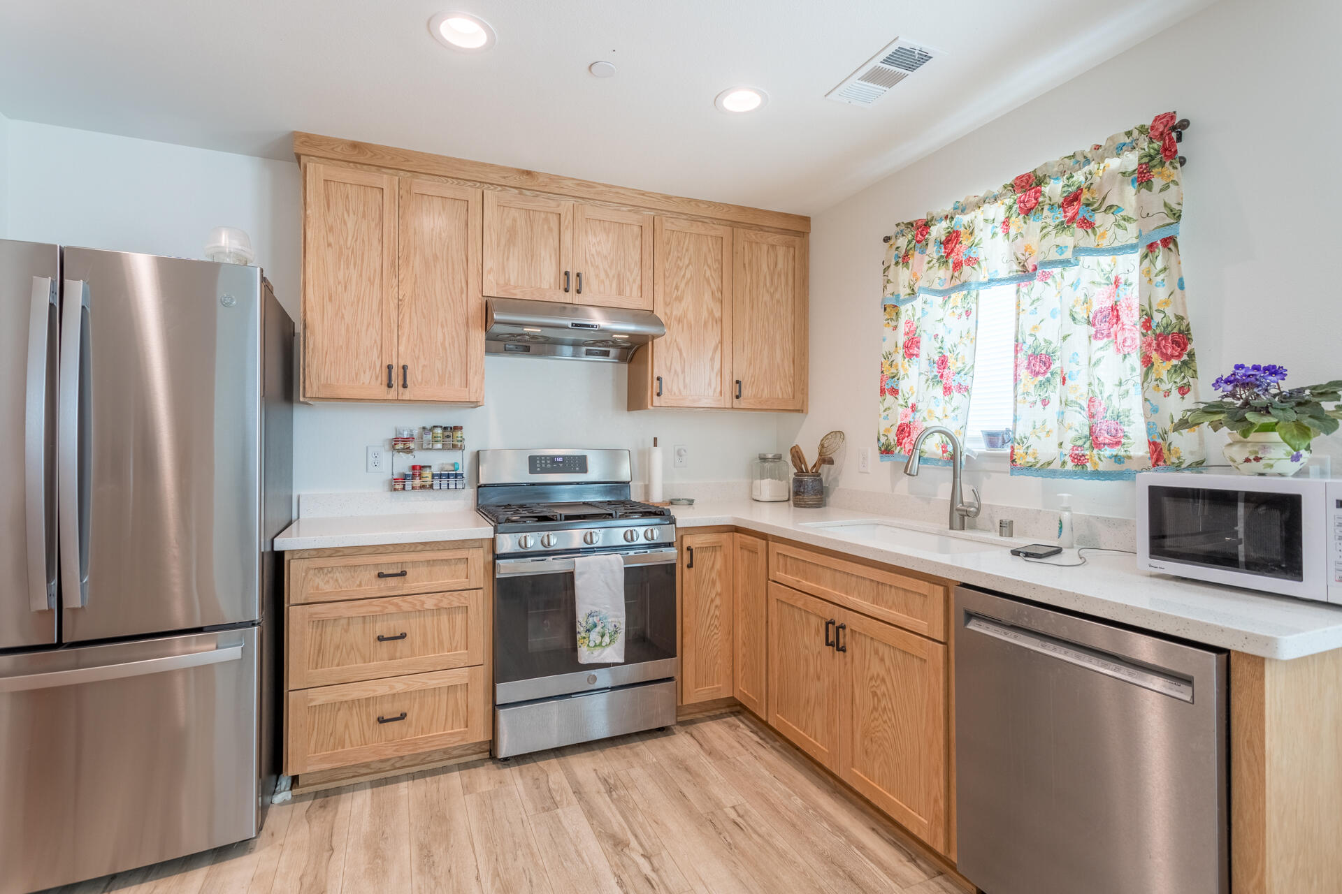 19983 Red Bank Road Red Bluff, CA 96080 - Photo 5 of 15 a kitchen with stainless steel appliances granite countertop a sink stove and refrigerator