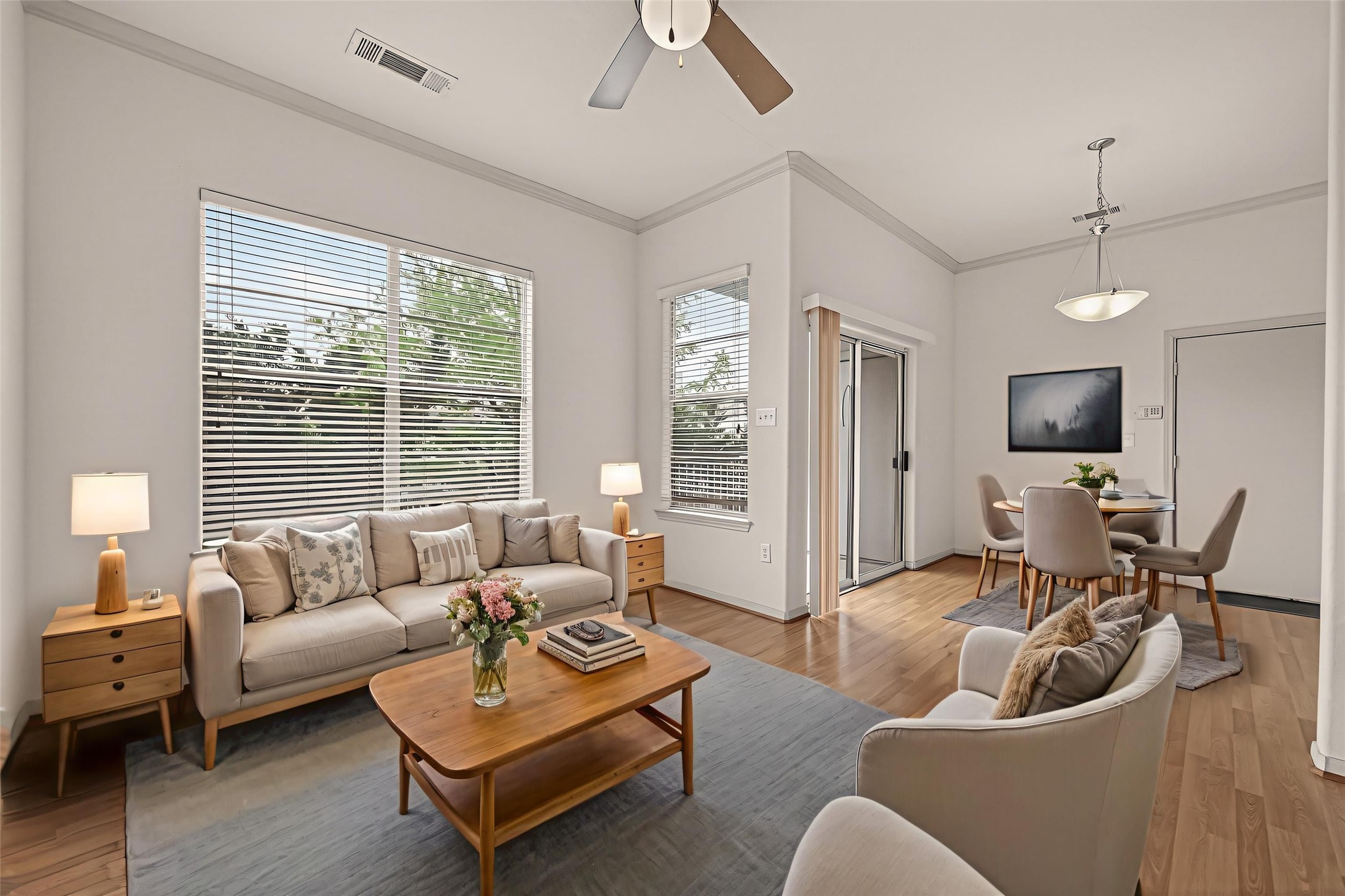 1441 East Street, Unit 308 Houston, TX 77007 - Photo 4 of 42 Spacious living area with high ceilings and natural light throughout. This photo is virtually staged to show one possible configuration of furniture.