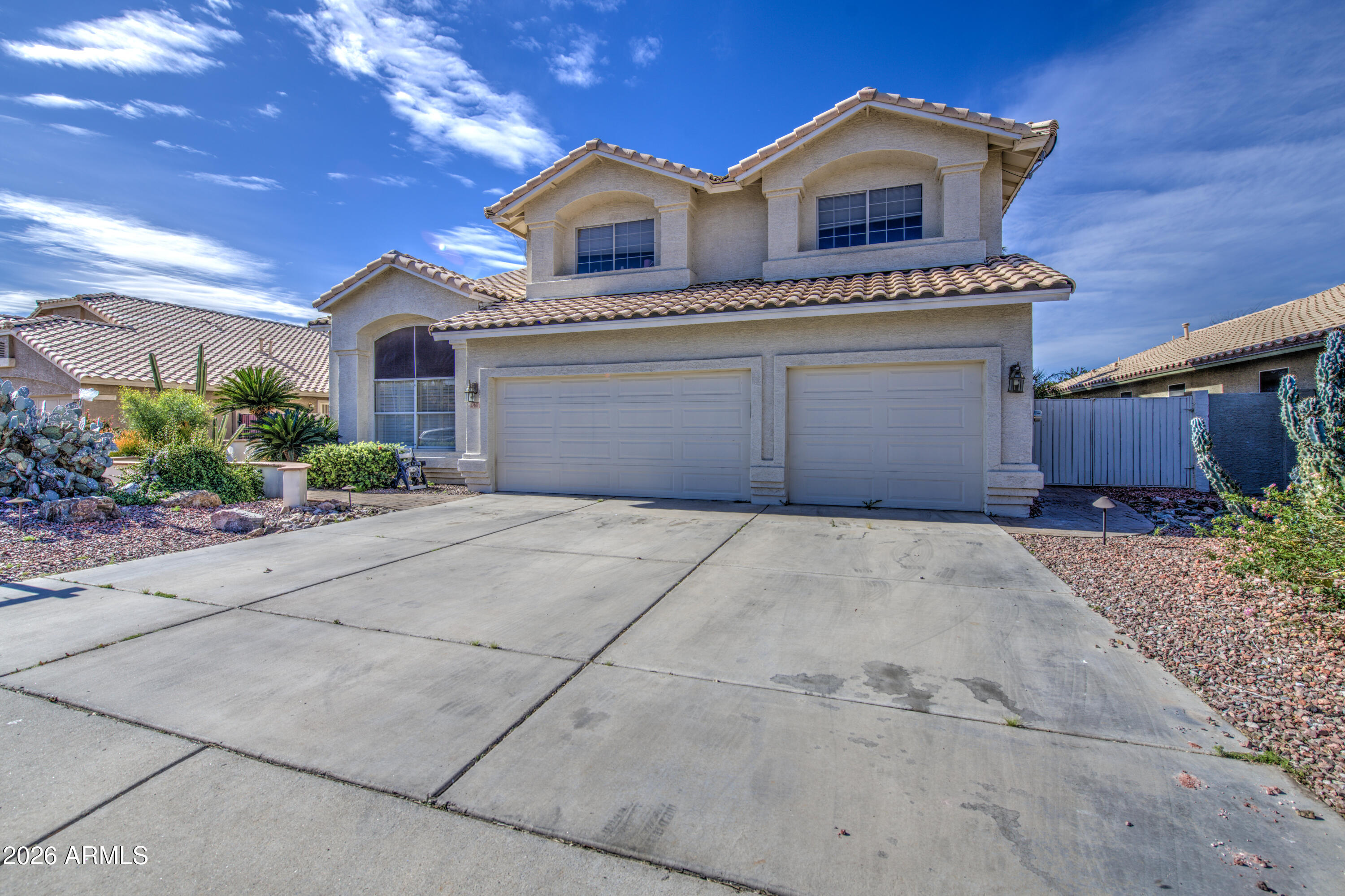 12403 West Monte Vista Road Avondale, AZ 85392 - Photo 1 of 63 a front view of a house with garden
