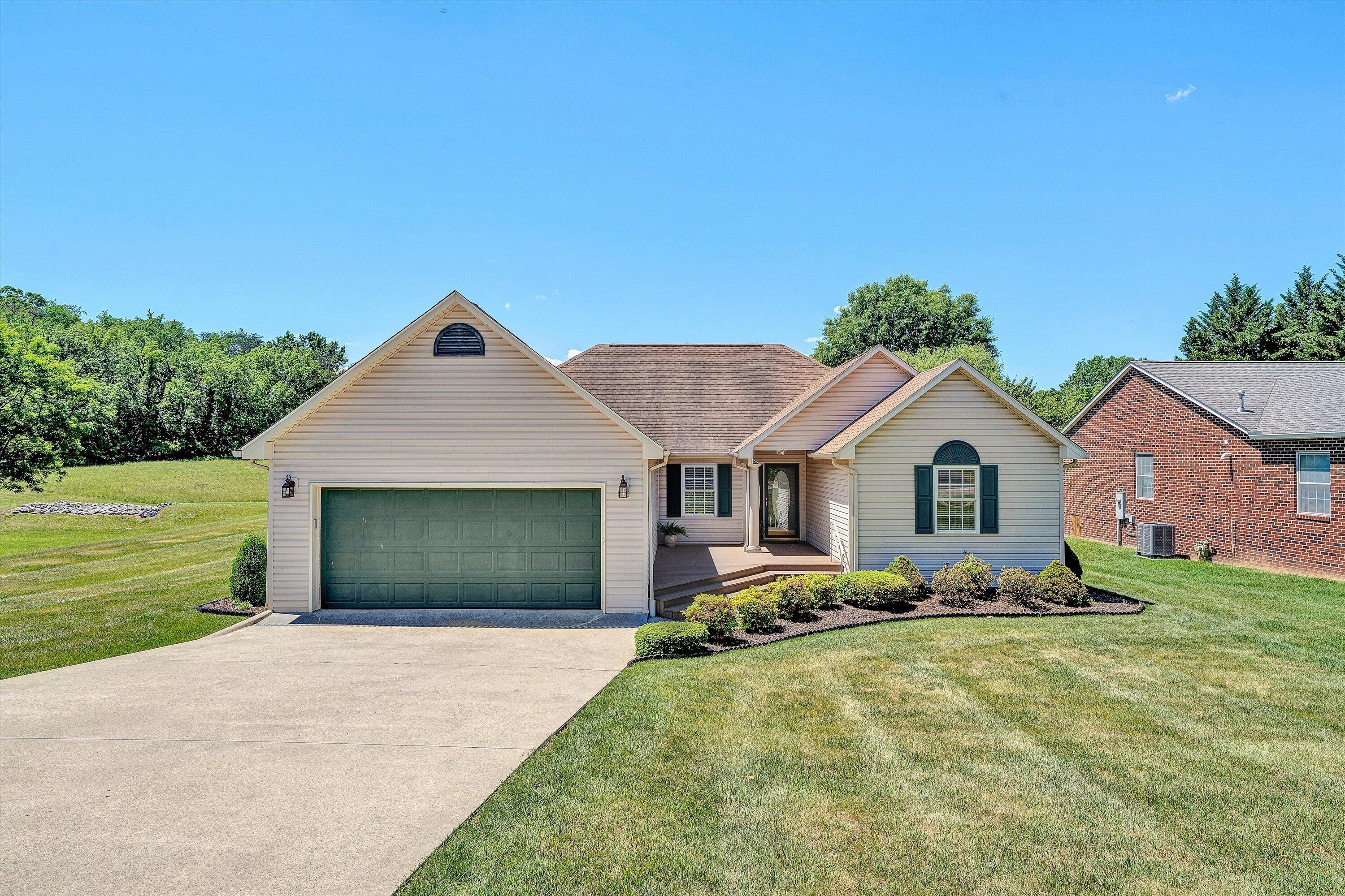 3516 Pinnacle Ridge Road Northeast Roanoke, VA 24012 - Photo 1 of 39 a front view of a house with garden