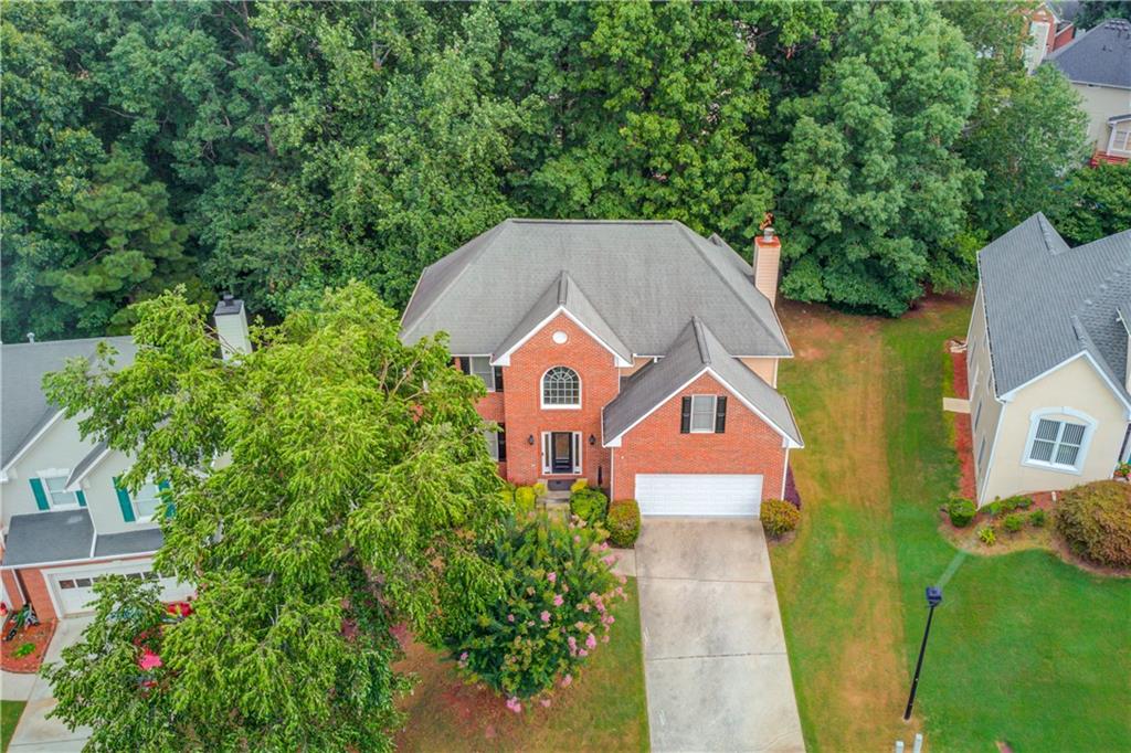 1446 Chadwick Ridge Court Lawrenceville, GA 30043 - Photo 2 of 54 an aerial view of a house next to a yard with potted plants