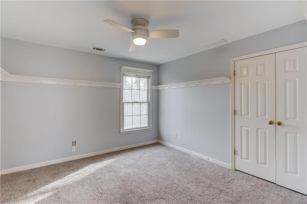 1446 Chadwick Ridge Court Lawrenceville, GA 30043 - Photo 28 of 54 a view of an empty room with a window