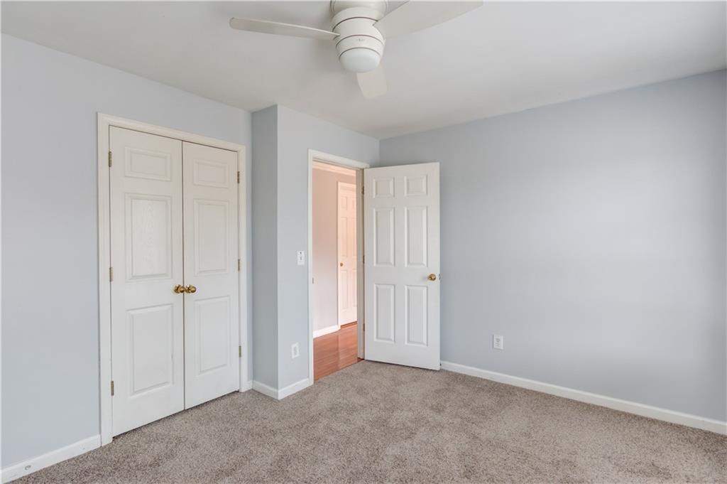 1446 Chadwick Ridge Court Lawrenceville, GA 30043 - Photo 32 of 54 an empty room with a empty space