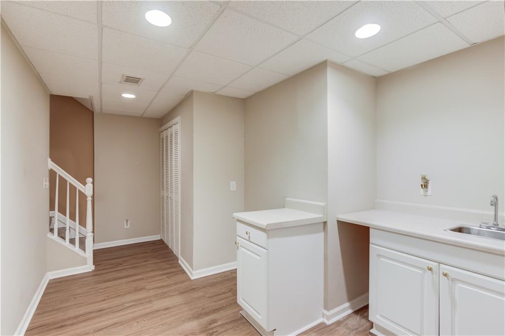 1446 Chadwick Ridge Court Lawrenceville, GA 30043 - Photo 34 of 54 a bathroom with a sink a toilet and a mirror