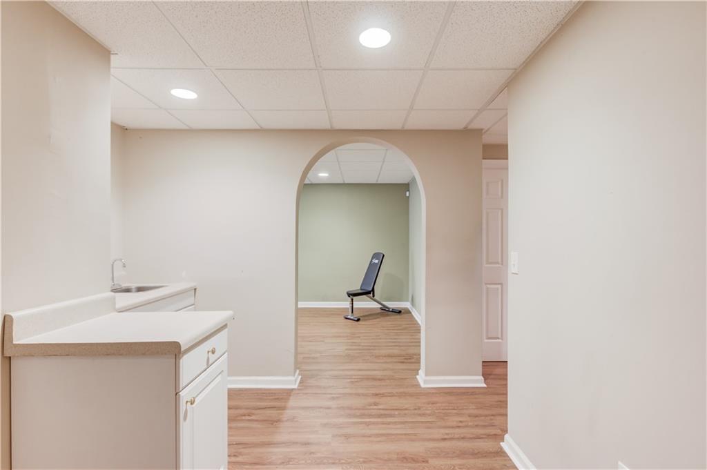 1446 Chadwick Ridge Court Lawrenceville, GA 30043 - Photo 35 of 54 a en suite bathroom with a sink and mirror