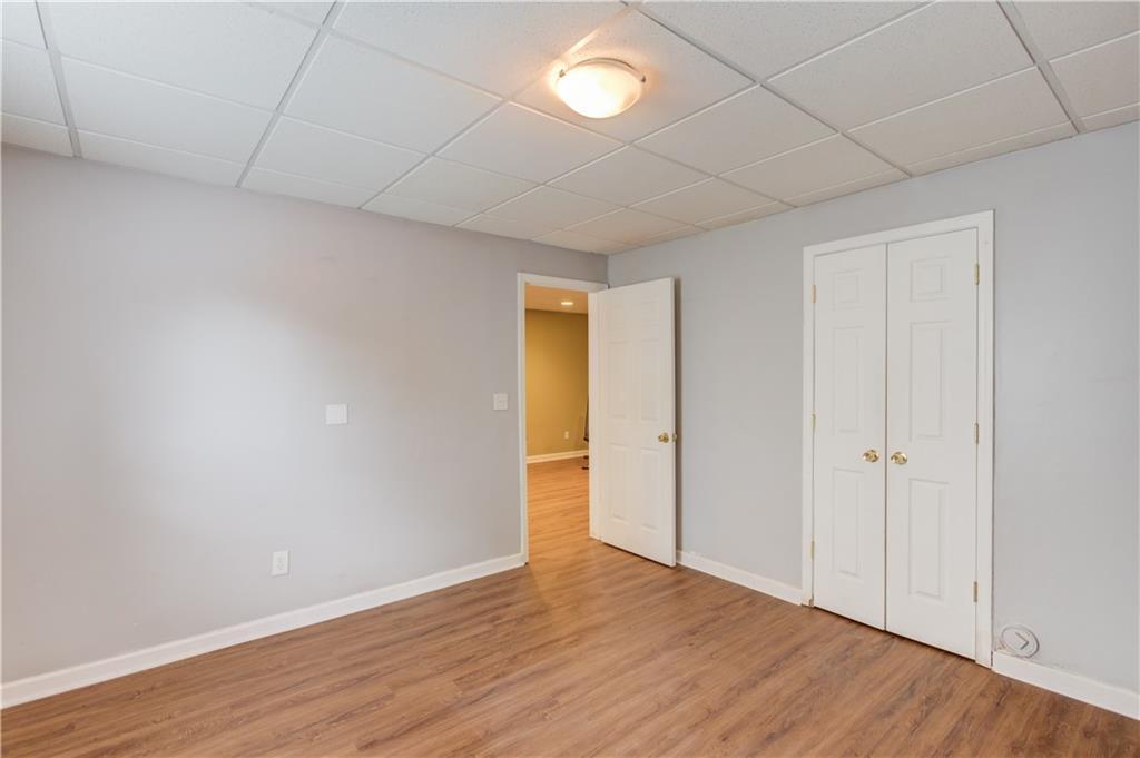 1446 Chadwick Ridge Court Lawrenceville, GA 30043 - Photo 39 of 54 a view of an empty room with wooden floor
