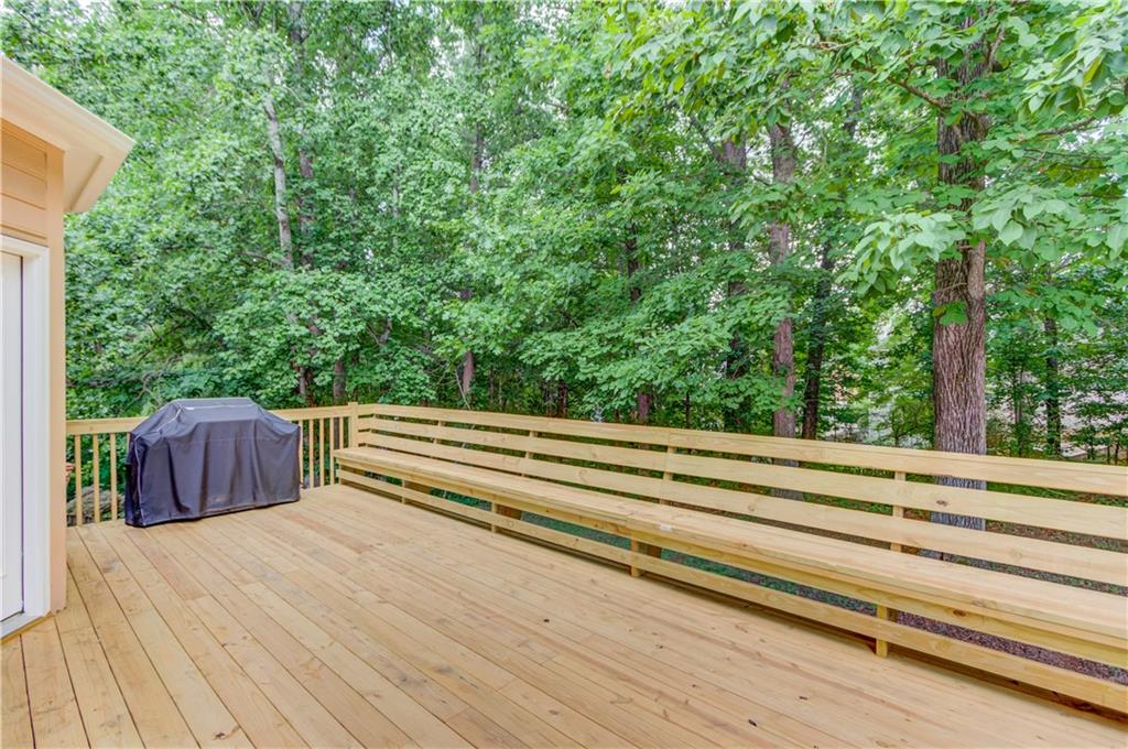 1446 Chadwick Ridge Court Lawrenceville, GA 30043 - Photo 43 of 54 a view of backyard with wooden floor and fence
