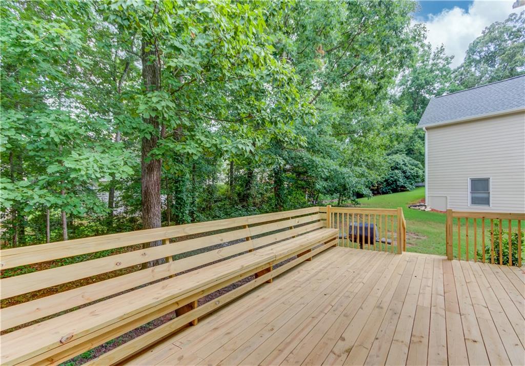 1446 Chadwick Ridge Court Lawrenceville, GA 30043 - Photo 44 of 54 a view of house with deck and yard