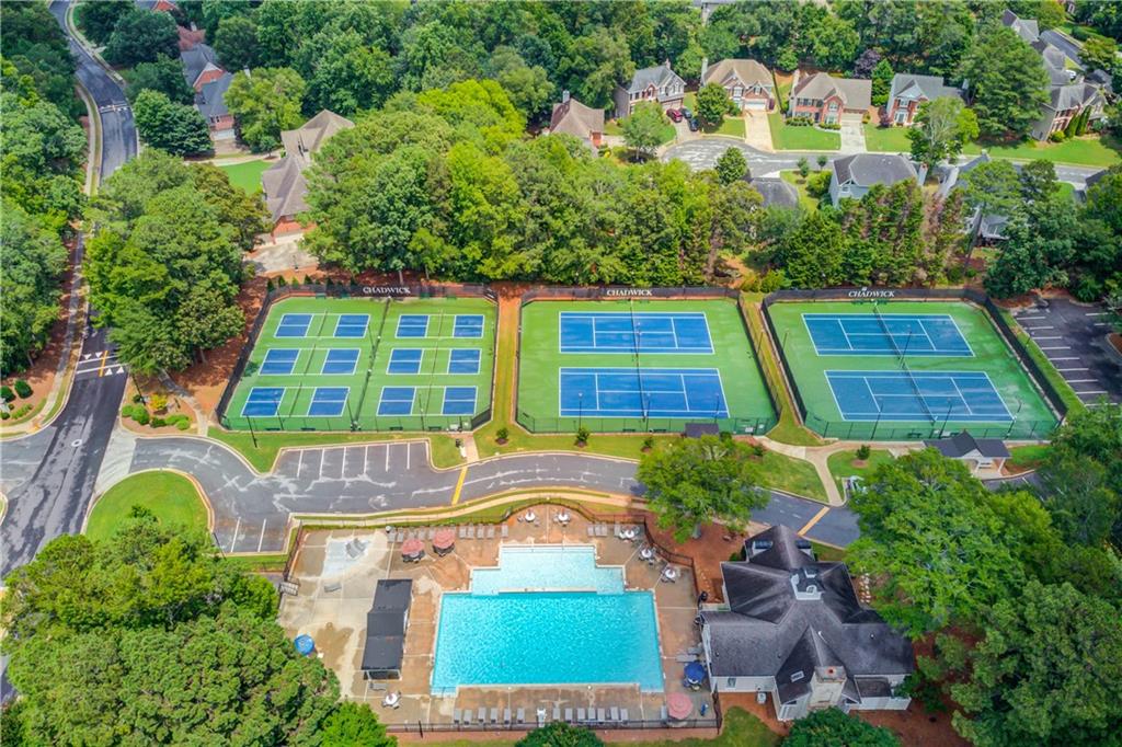 1446 Chadwick Ridge Court Lawrenceville, GA 30043 - Photo 50 of 54 an aerial view of a house with a swimming pool