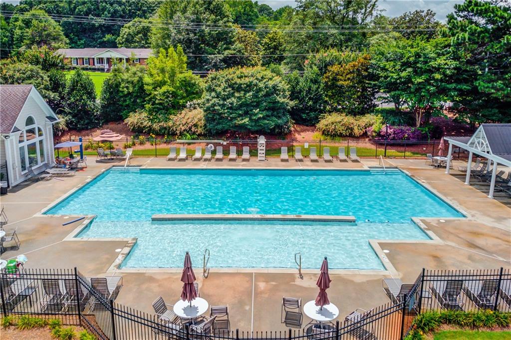 1446 Chadwick Ridge Court Lawrenceville, GA 30043 - Photo 51 of 54 a view of swimming pool with seating area