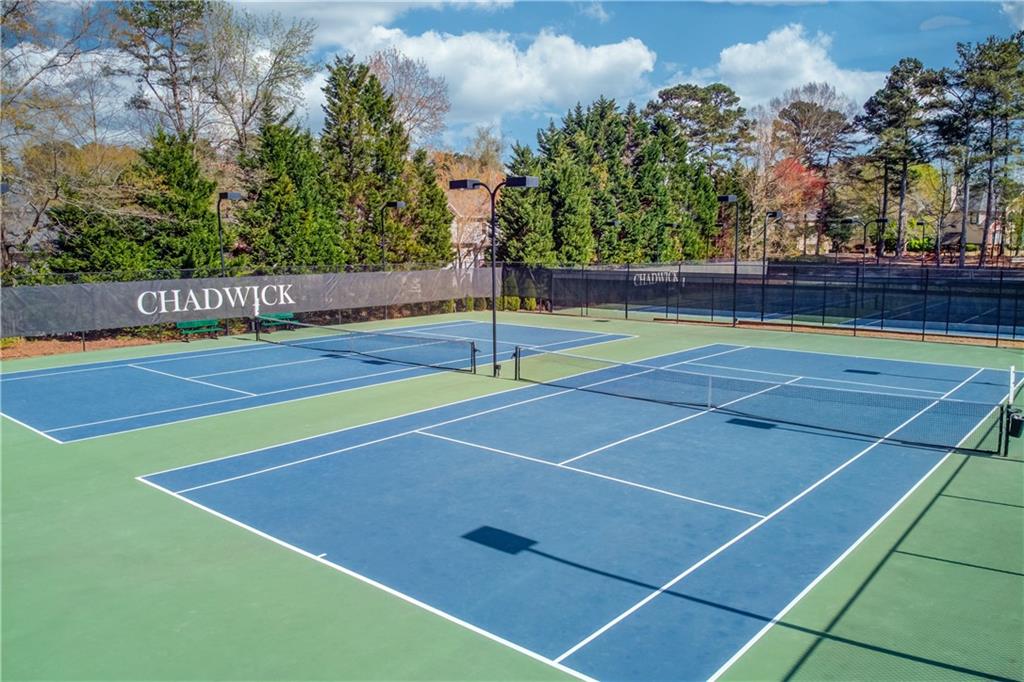 1446 Chadwick Ridge Court Lawrenceville, GA 30043 - Photo 53 of 54 a view of an outdoor space and tennis court