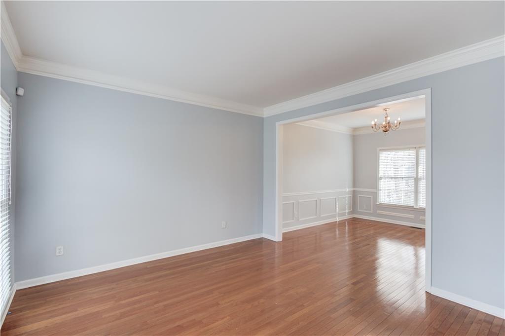 1446 Chadwick Ridge Court Lawrenceville, GA 30043 - Photo 7 of 54 a view of wooden floor and windows in a room
