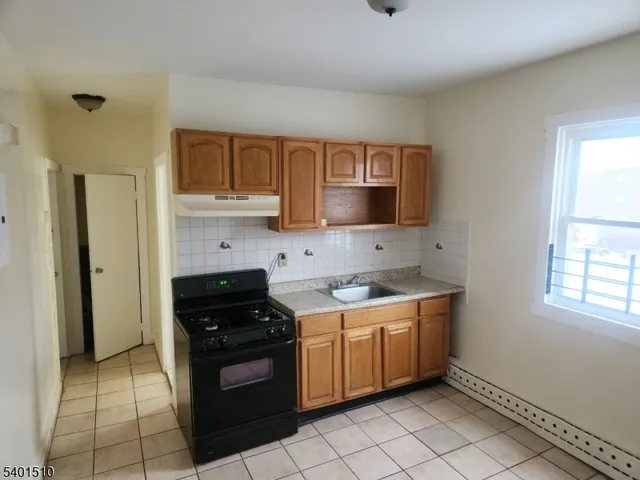 a kitchen with a stove and a sink