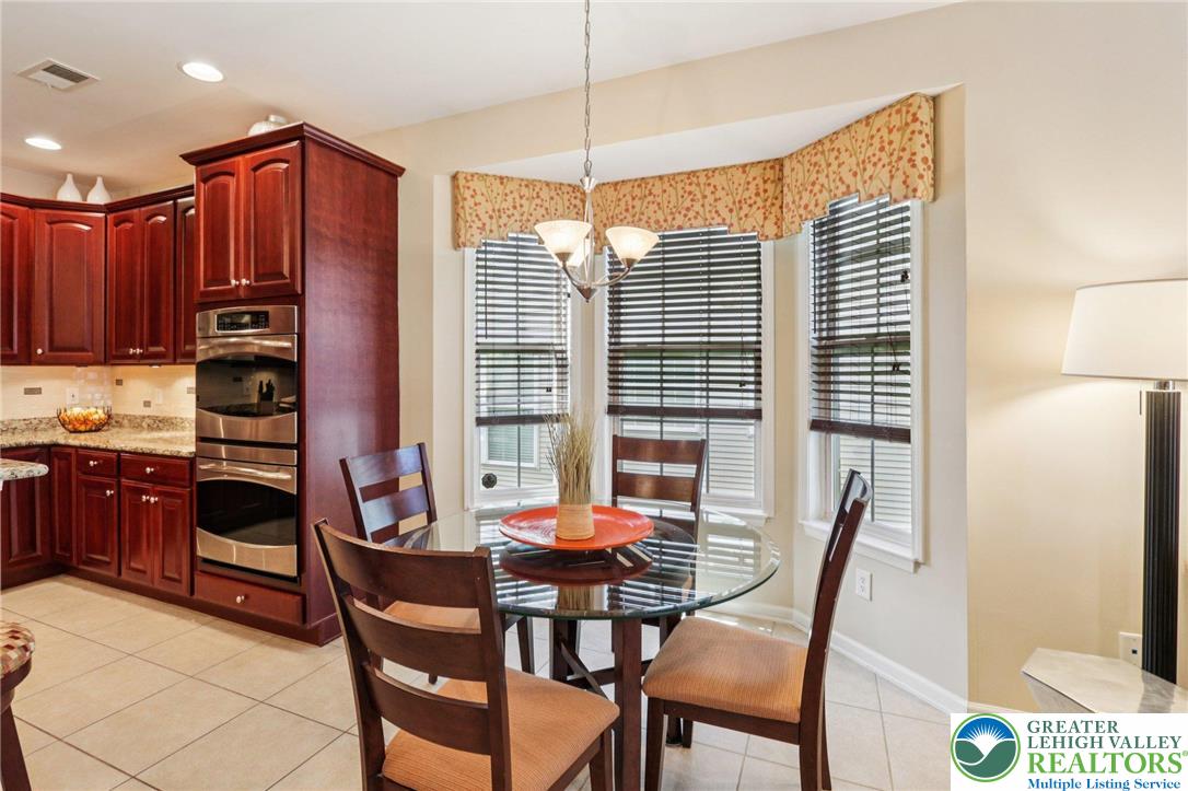 2113 Kingsview Road Lower Macungie Township, PA 18062 - Photo 19 of 62 a view of a dining room with furniture and window