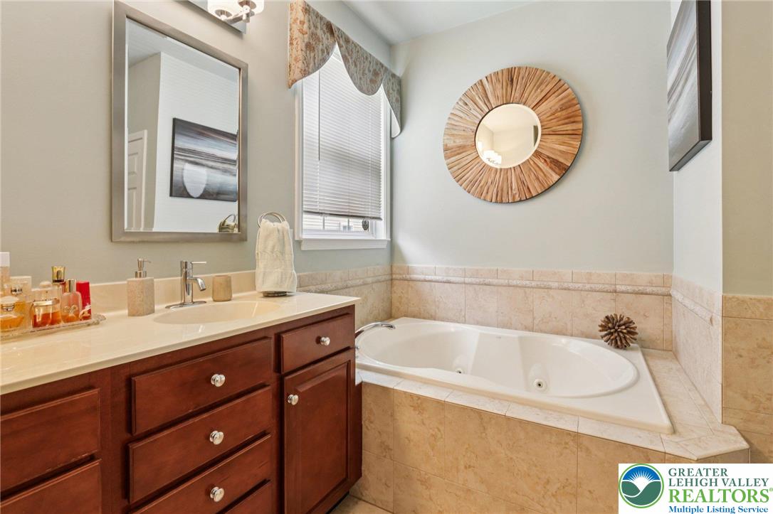 2113 Kingsview Road Lower Macungie Township, PA 18062 - Photo 31 of 62 a bathroom with a bathtub and a sink