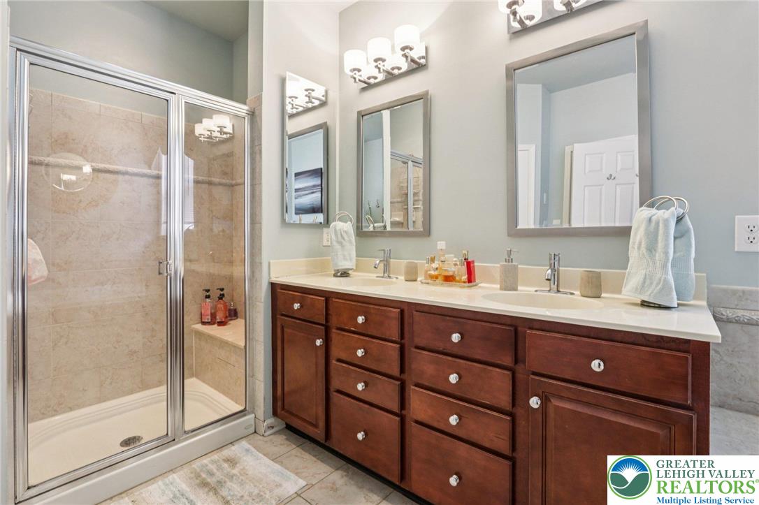 2113 Kingsview Road Lower Macungie Township, PA 18062 - Photo 32 of 62 a bathroom with a sink double vanity and shower