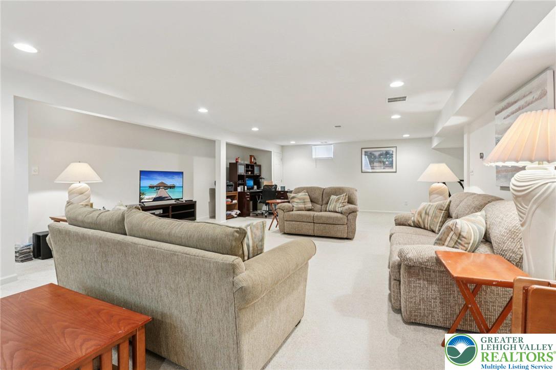 2113 Kingsview Road Lower Macungie Township, PA 18062 - Photo 35 of 62 a living room with furniture and a lamp