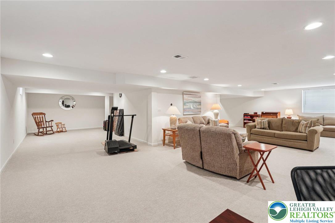 2113 Kingsview Road Lower Macungie Township, PA 18062 - Photo 39 of 62 a living room with furniture a couch and a table