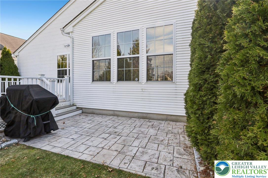 2113 Kingsview Road Lower Macungie Township, PA 18062 - Photo 42 of 62 a backyard of a house with barbeque oven and large trees