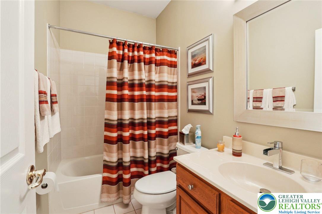 2113 Kingsview Road Lower Macungie Township, PA 18062 - Photo 10 of 62 a bathroom with a sink toilet vanity and shower
