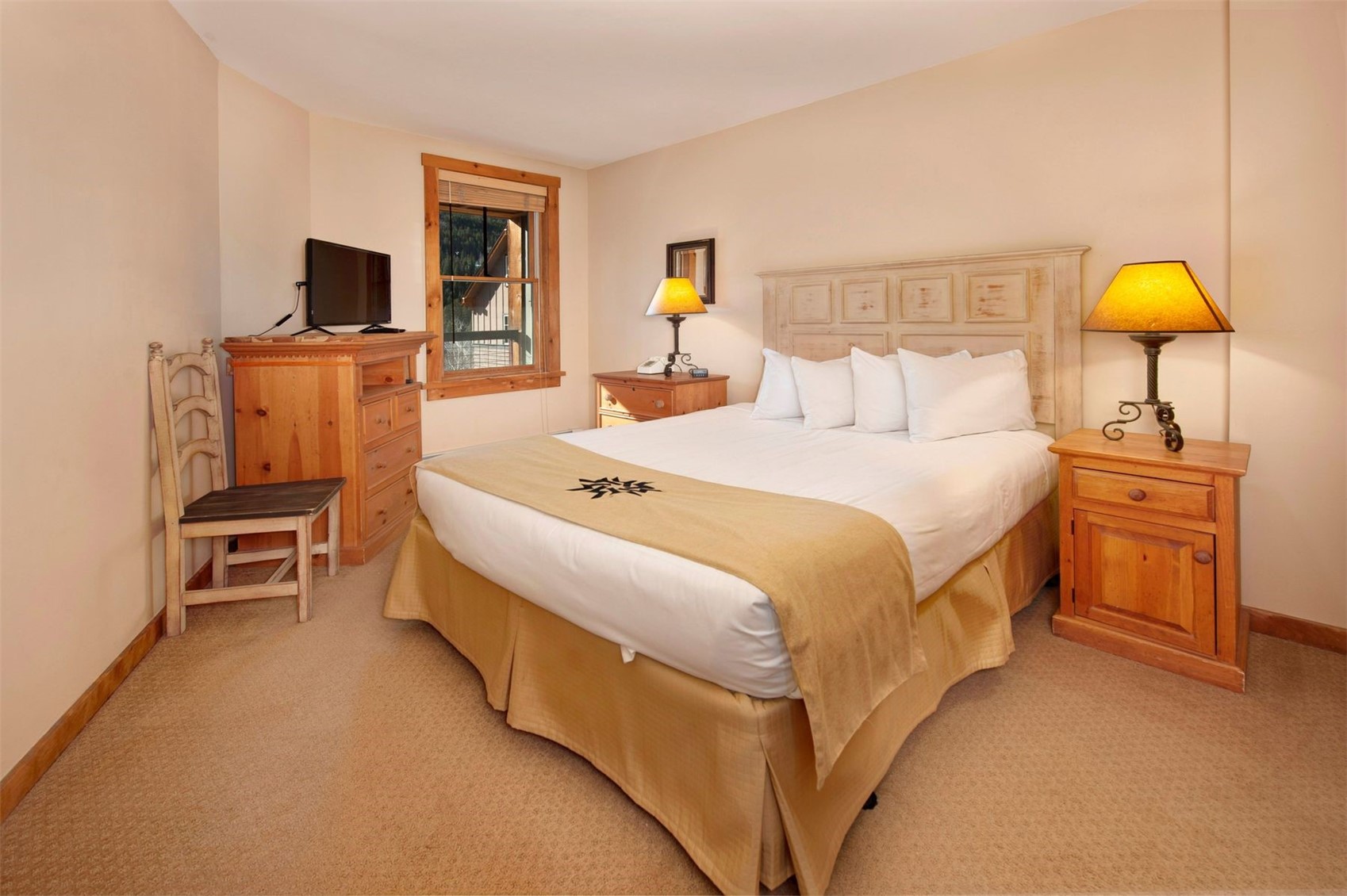 100 Dercum Square, Unit 8371 Keystone, CO 80435 - Photo 13 of 33 a spacious bedroom with a bed and a flat screen tv