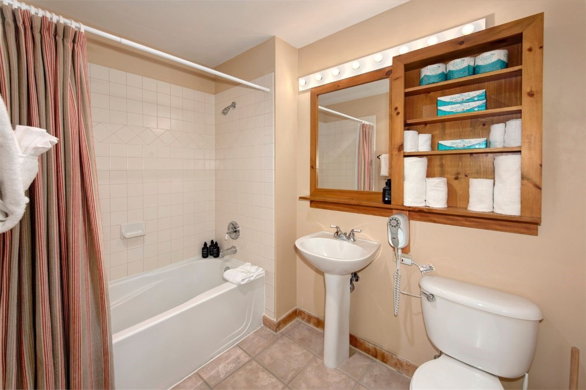 100 Dercum Square, Unit 8371 Keystone, CO 80435 - Photo 16 of 33 a bathroom with a sink a toilet and shower