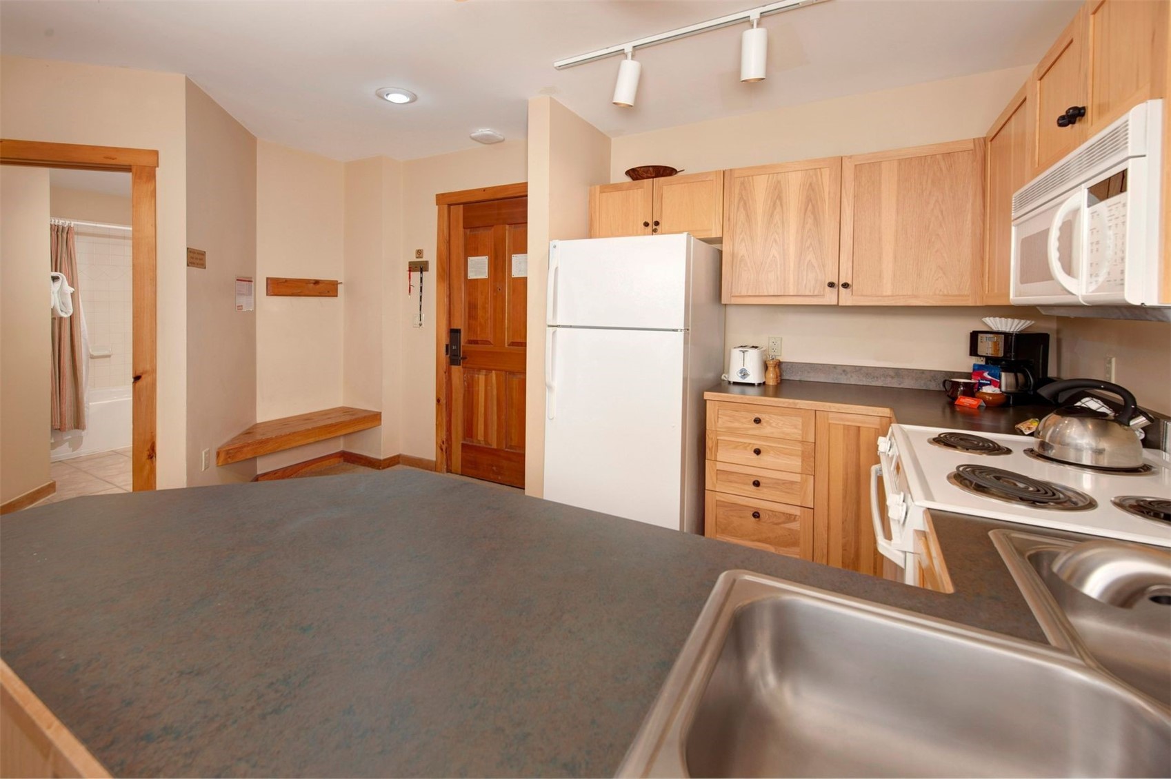 100 Dercum Square, Unit 8371 Keystone, CO 80435 - Photo 7 of 33 a kitchen with stainless steel appliances granite countertop a refrigerator sink and cabinets