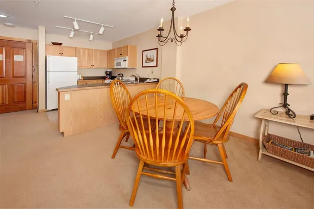 a very nice looking dining room with a table and chairs