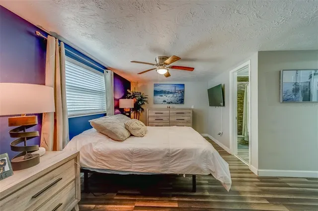 a bathroom with a toilet and shower curtain