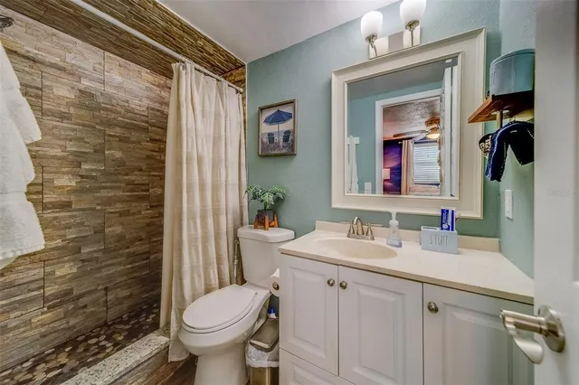 a view of a workspace with wooden floor and furniture