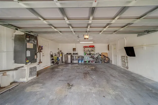 an aerial view of a house with outdoor space and lake view
