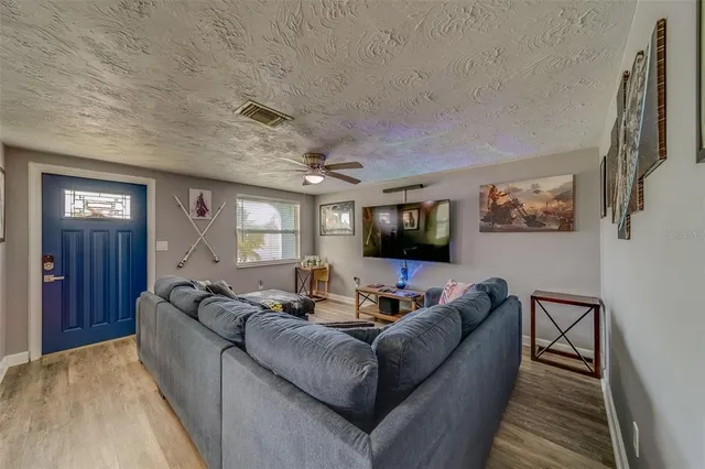 a view of a livingroom with furniture and window