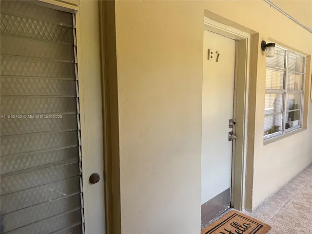 a bedroom with furniture and a flat screen tv