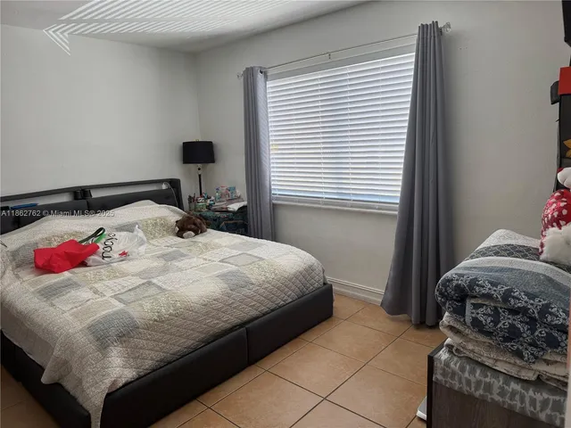 a bedroom with a bed and tv